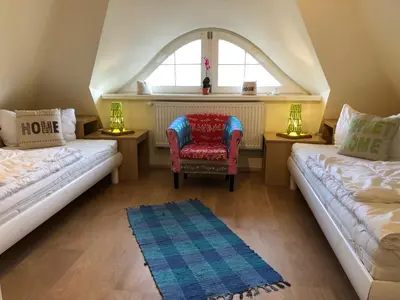 Ein Bett oder Betten in einem Zimmer der Unterkunft Friedenstrasse Haus Kranich
