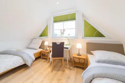 Ein Bett oder Betten in einem Zimmer der Unterkunft Haus Bugspriet Hägerende