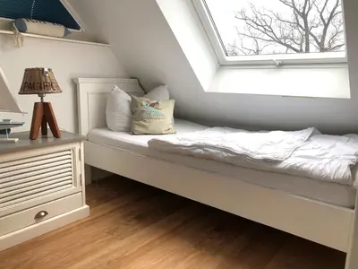 Ein Bett oder Betten in einem Zimmer der Unterkunft Kavelweg Haus JENNY