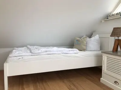 Ein Bett oder Betten in einem Zimmer der Unterkunft Kavelweg Haus JENNY