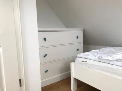 Ein Bett oder Betten in einem Zimmer der Unterkunft Kavelweg Haus JENNY