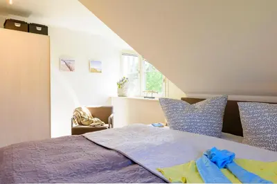 Ein Bett oder Betten in einem Zimmer der Unterkunft Kavelweg Heimathafen