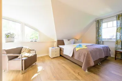 Ein Bett oder Betten in einem Zimmer der Unterkunft Kavelweg Heimathafen
