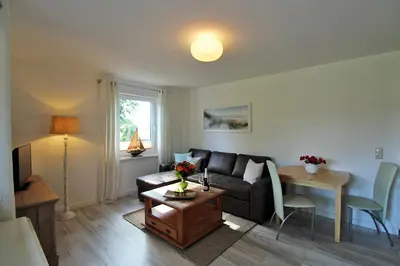 Ein Sitzbereich in der Unterkunft Zur Alten Boddenfischerei Ferienwohnung Zander
