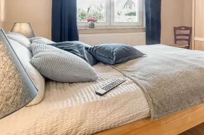 Ein Bett oder Betten in einem Zimmer der Unterkunft Leuchtturm, Wohnung 14