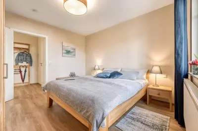 Ein Bett oder Betten in einem Zimmer der Unterkunft Leuchtturm, Wohnung 14
