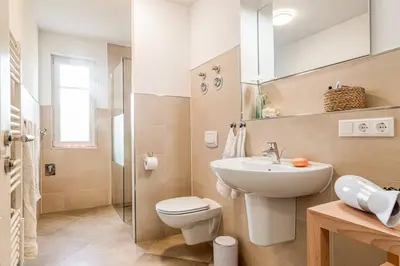 Ein Badezimmer in der Unterkunft Leuchtturm, Wohnung 14