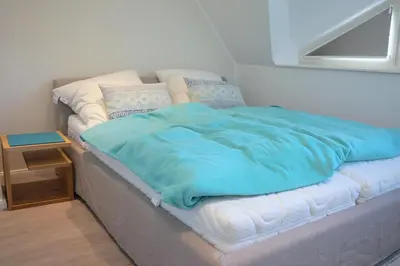Ein Bett oder Betten in einem Zimmer der Unterkunft Rosenbergsiedlung 