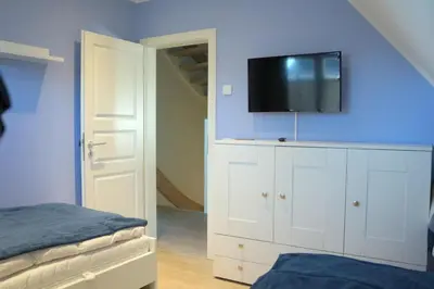 Ein Bett oder Betten in einem Zimmer der Unterkunft Rosenbergsiedlung 