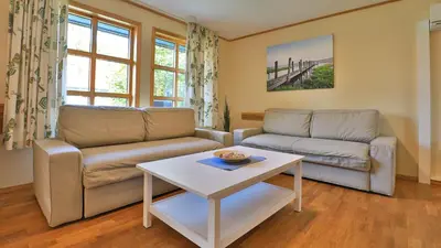 Ein Sitzbereich in der Unterkunft Heideröschen Park - Haus 5a