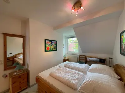 Ein Bett oder Betten in einem Zimmer der Unterkunft Alte Reihe 9 Wohnung 5
