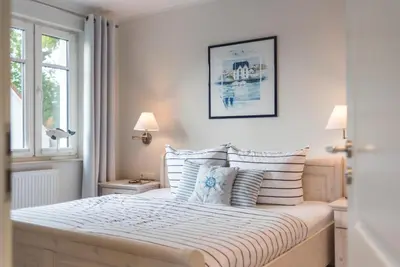 Ein Bett oder Betten in einem Zimmer der Unterkunft Alte Reihe 7 Wohnung 3 Ostseeperle