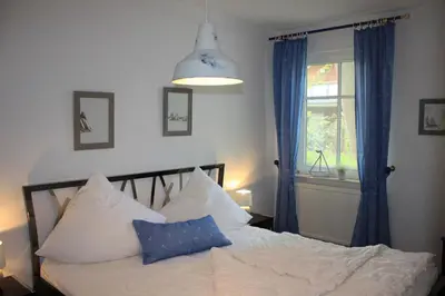 Ein Bett oder Betten in einem Zimmer der Unterkunft Alte Reihe 9 Wohnung 1