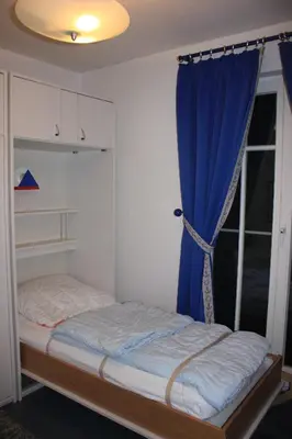 Ein Bett oder Betten in einem Zimmer der Unterkunft Alte Reihe 9 Wohnung 1