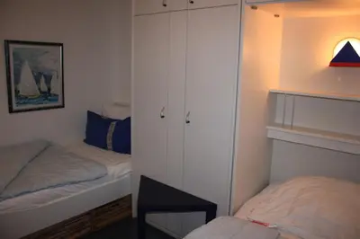 Ein Bett oder Betten in einem Zimmer der Unterkunft Alte Reihe 9 Wohnung 1