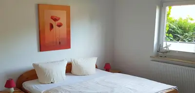 Ein Bett oder Betten in einem Zimmer der Unterkunft Alte Gärtnerei App Rhododendron