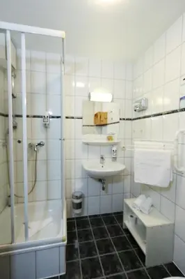 Ein Badezimmer in der Unterkunft Captain Pahlen Ferienanlage