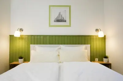 Ein Bett oder Betten in einem Zimmer der Unterkunft Captain Pahlen Ferienanlage