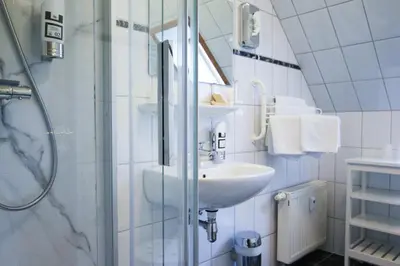 Ein Badezimmer in der Unterkunft Captain Pahlen Ferienanlage