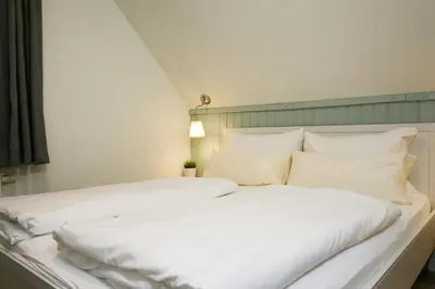 Ein Bett oder Betten in einem Zimmer der Unterkunft Captain Pahlen Ferienanlage