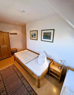 Ein Bett oder Betten in einem Zimmer der Unterkunft Birkenstr.17 A OG