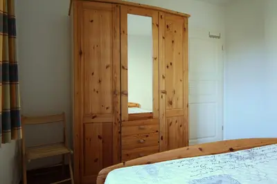 Ein Bett oder Betten in einem Zimmer der Unterkunft Ostseekieker