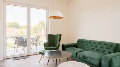 Ein Sitzbereich in der Unterkunft Apartmenthaus Wittsande - 01