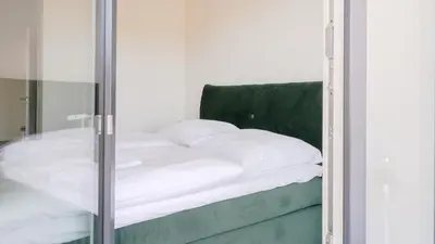 Ein Bett oder Betten in einem Zimmer der Unterkunft Apartmenthaus Wittsande - 01