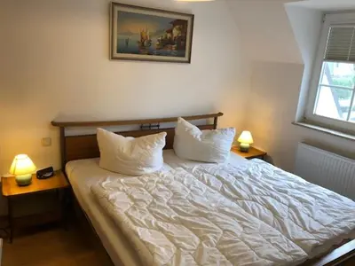Ein Bett oder Betten in einem Zimmer der Unterkunft Birkenstrasse 5 F Wohnung 7 