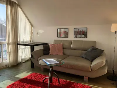 Ein Sitzbereich in der Unterkunft Birkenstrasse.6 i Wohnung 12