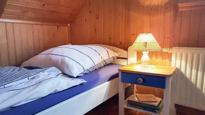 Ein Bett oder Betten in einem Zimmer der Unterkunft Birkmaase 3 Muschelblau OG