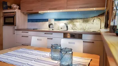 Küche/Küchenzeile in der Unterkunft Birkmaase 3 Muschelblau OG