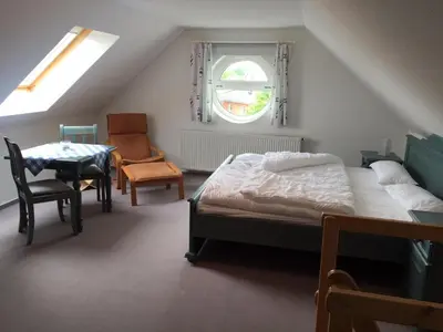 Ein Bett oder Betten in einem Zimmer der Unterkunft Darsser Weg