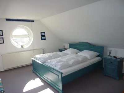Ein Bett oder Betten in einem Zimmer der Unterkunft Darsser Weg