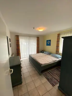 Ein Bett oder Betten in einem Zimmer der Unterkunft Darsser Weg 36