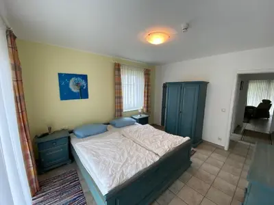 Ein Bett oder Betten in einem Zimmer der Unterkunft Darsser Weg 36