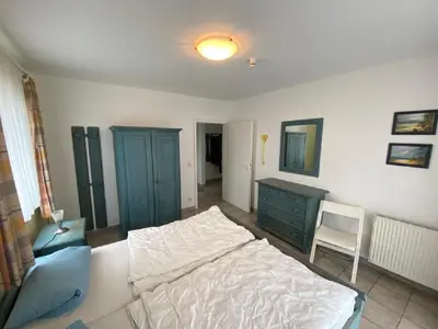 Ein Bett oder Betten in einem Zimmer der Unterkunft Darsser Weg 36