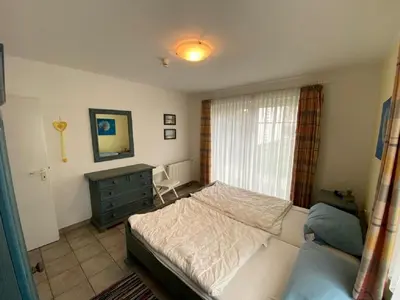 Ein Bett oder Betten in einem Zimmer der Unterkunft Darsser Weg 36
