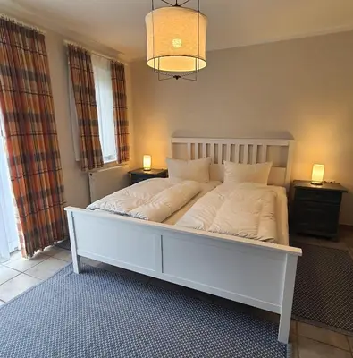 Ein Bett oder Betten in einem Zimmer der Unterkunft Darsser Weg 36 a
