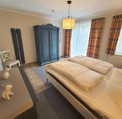 Ein Bett oder Betten in einem Zimmer der Unterkunft Darsser Weg 36 a