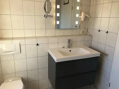 Ein Badezimmer in der Unterkunft Darsser Weg 34