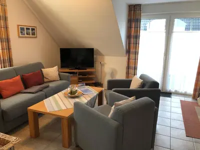 Ein Sitzbereich in der Unterkunft Darsser Weg 34