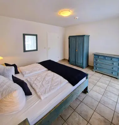 Ein Bett oder Betten in einem Zimmer der Unterkunft Darsser Weg 34 a