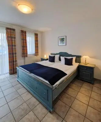 Ein Bett oder Betten in einem Zimmer der Unterkunft Darsser Weg 34 a