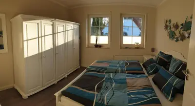 Ein Bett oder Betten in einem Zimmer der Unterkunft Haus Seeteufel