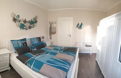 Ein Bett oder Betten in einem Zimmer der Unterkunft Haus Seeteufel
