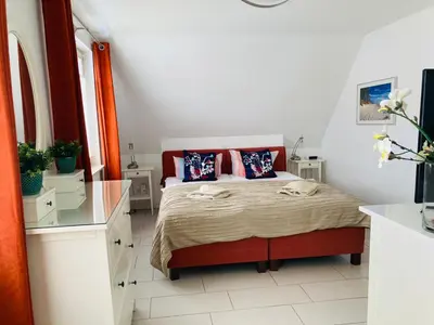Ein Bett oder Betten in einem Zimmer der Unterkunft Doppelhaushälfte Birkenstraße 5e