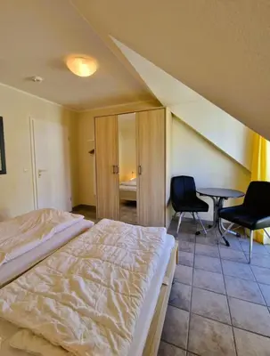 Ein Bett oder Betten in einem Zimmer der Unterkunft Darsser Weg 38a