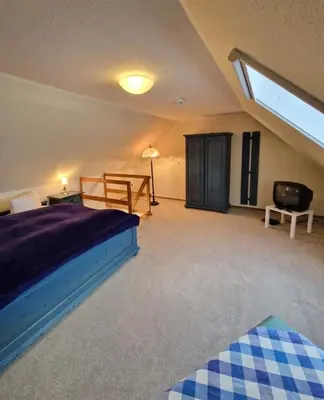 Ein Bett oder Betten in einem Zimmer der Unterkunft Darsser Weg 38a