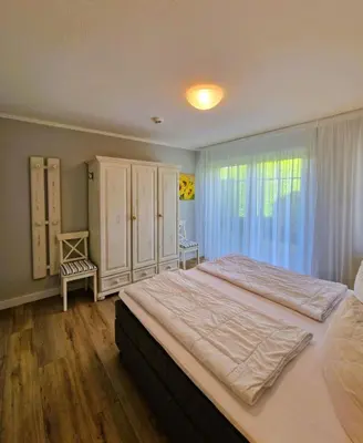 Ein Bett oder Betten in einem Zimmer der Unterkunft Darsser Weg 38